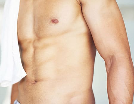 Photo of male torso after gynecomastia surgery
