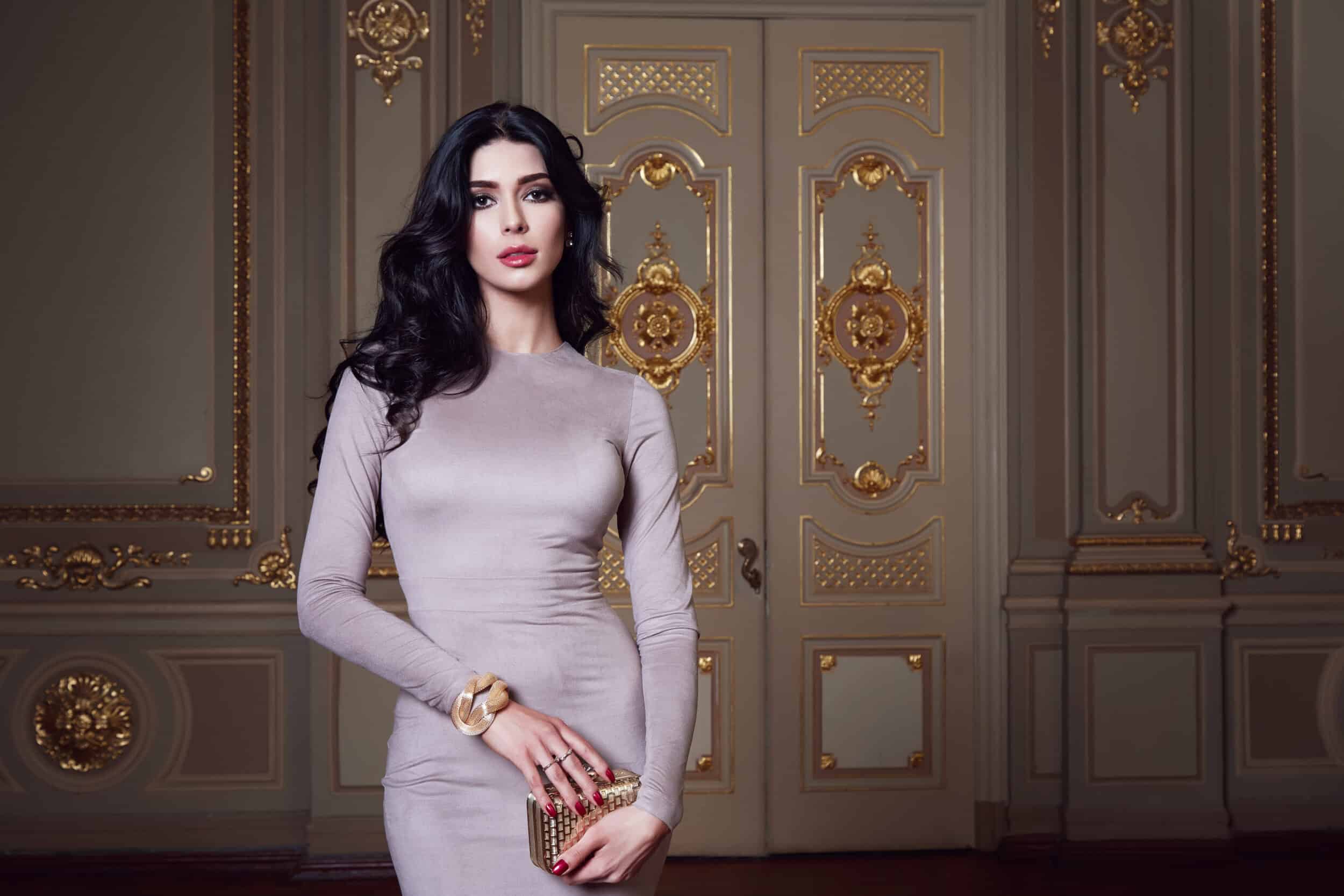 Elegant woman attends a formal event in a tight-fitting dress