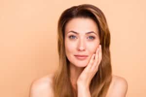 Mature woman has good-looking skin with non-surgical tightening from Plasma Pen.